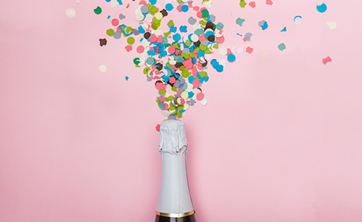 confetti and a champagne bottle