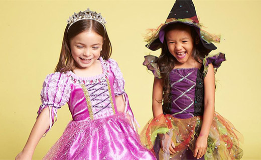 girls in princess and witch costumes