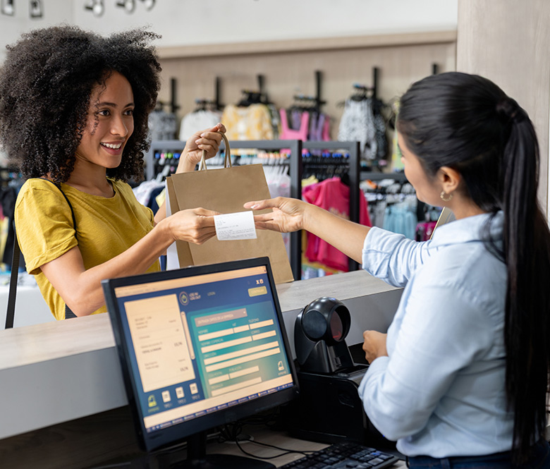A sales associate helping a customer at a mall store