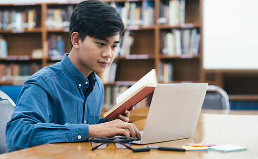 young man studying at desk