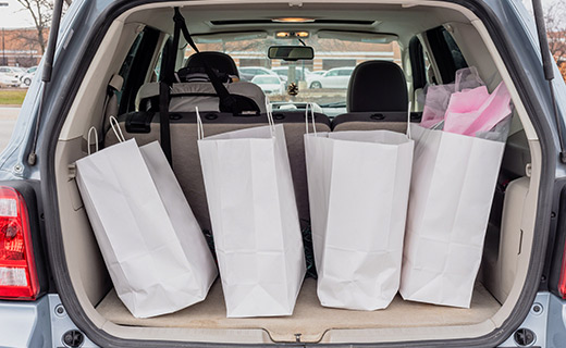 shopping bags in the trunk of a car