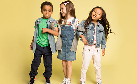 three elementary aged children posing together