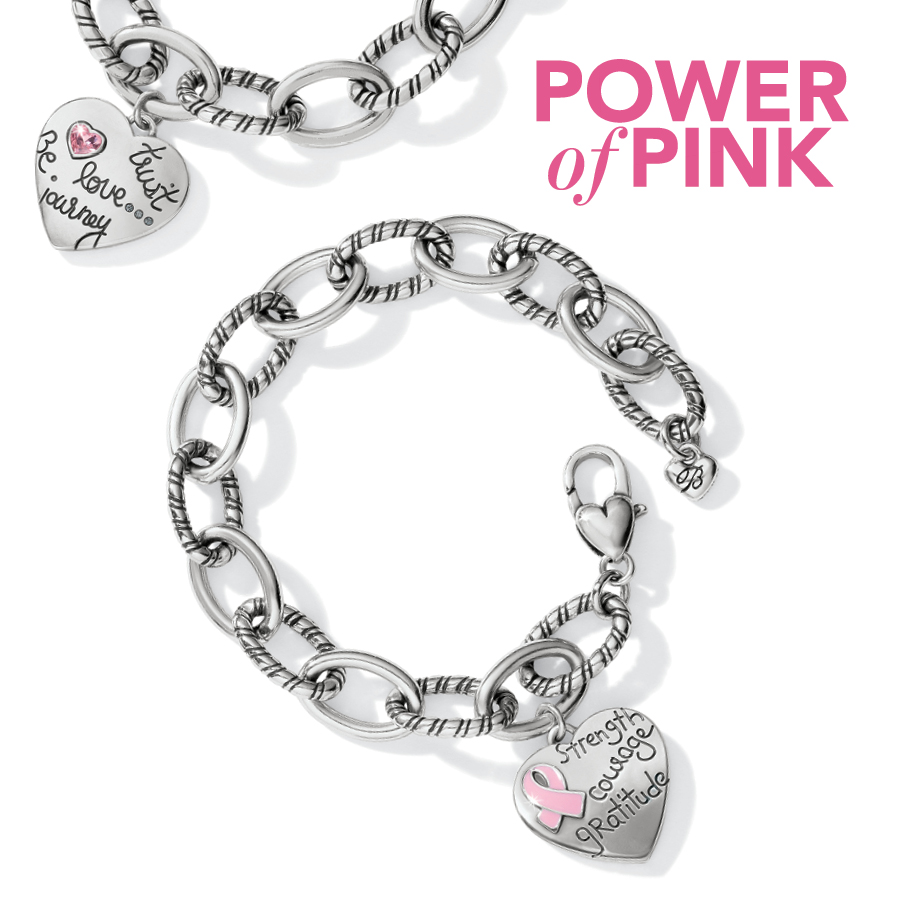 Two limited edition bracelets shown in silver tone with heart charm with breast cancer ribbon, strength, courage and gratitude on one, the other with a pink gemstone heart and trust, Be love, journey. Copy: Power of Pink