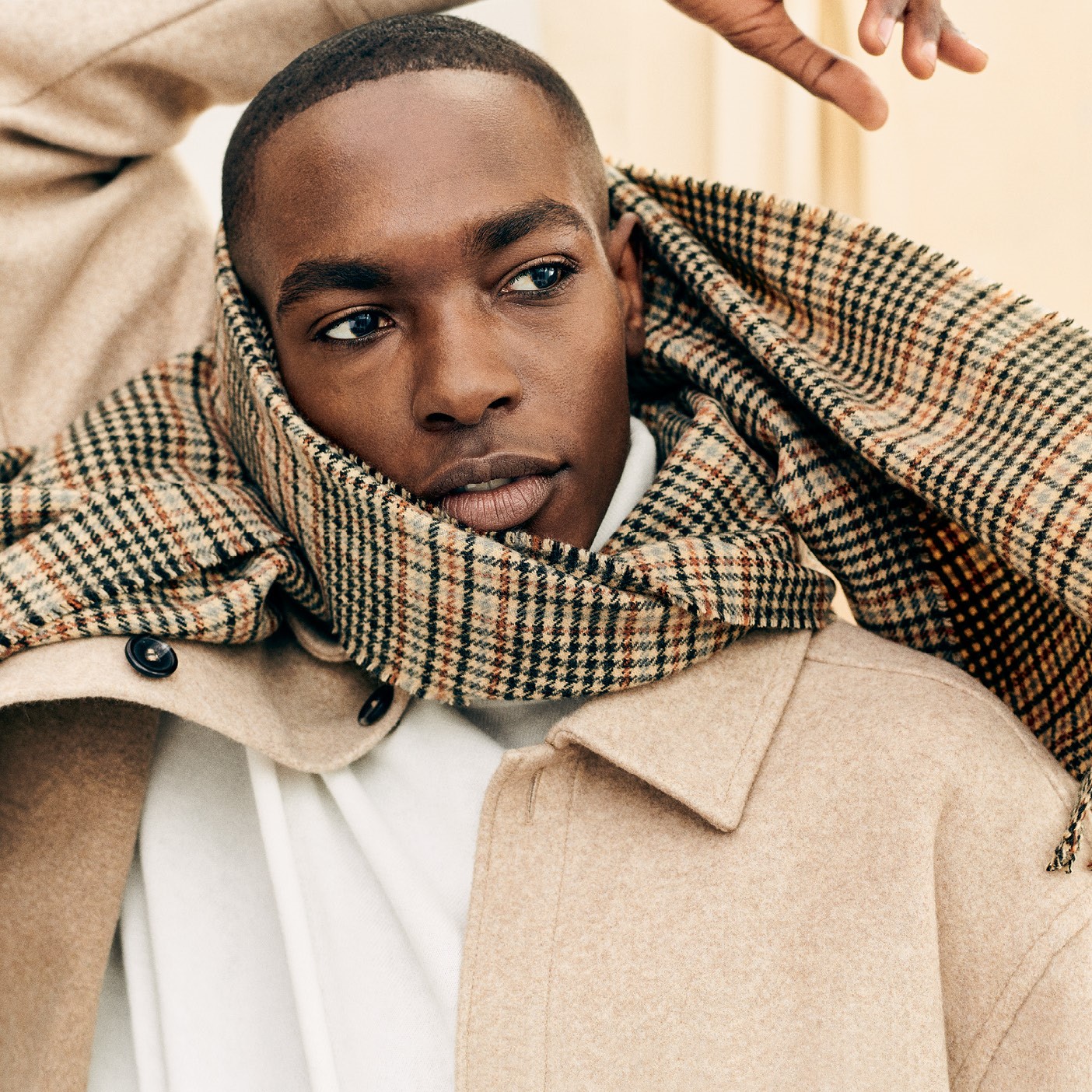 Man wearing coat and scarf