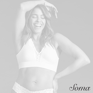 Soma logo. Image woman wearing bra and underwear smiling, standing with hand on hip and other arm over her head.