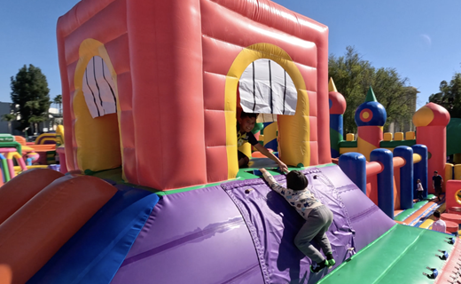 child climbing on inflatable tower