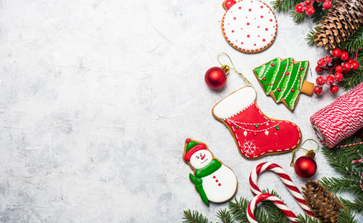 Christmas ornaments in multiple colors. Stockings, snowmen, candy canes, and Christmas trees. 