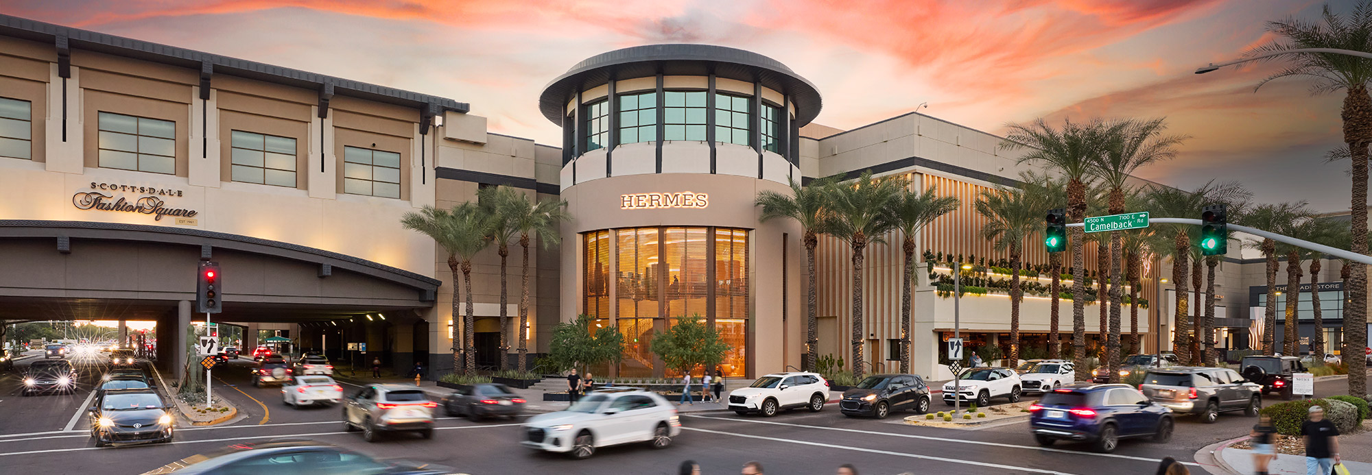 A view of the exterior of Scottsdale Fashion Square at dusk looking toward Hermes