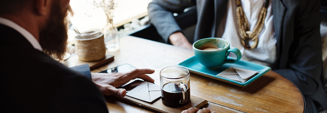 Couple sitting drinking coffee