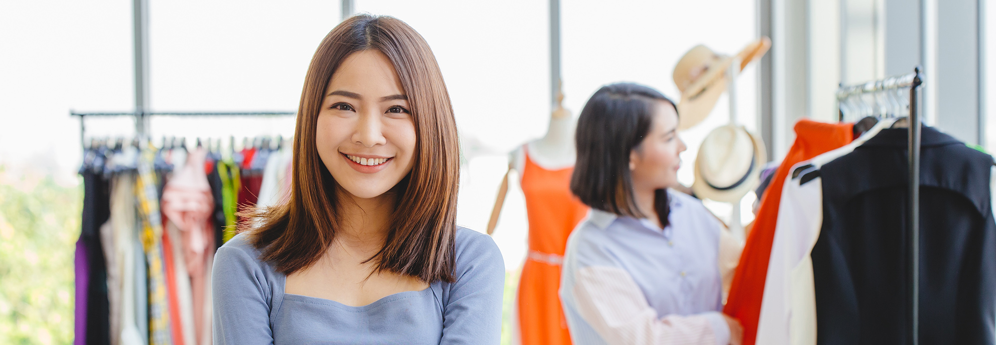 A clothing store employee and a customer