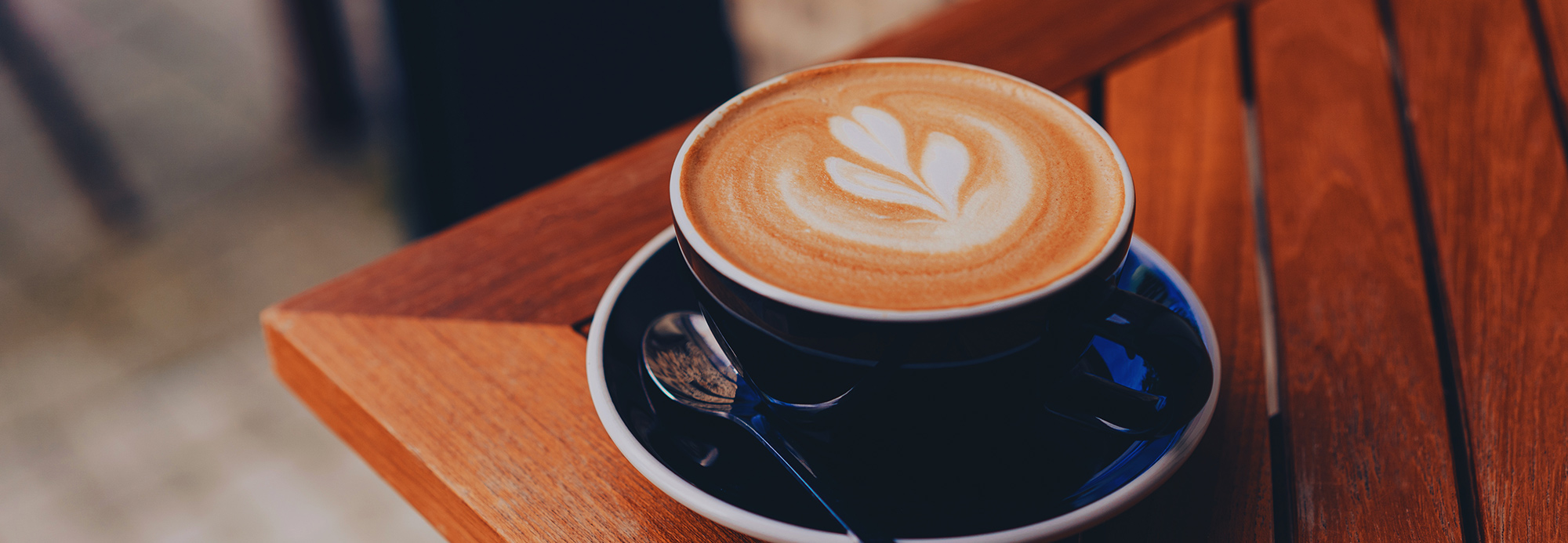 A cappuccino on a wooden table