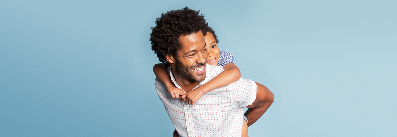 Dad piggybacking daughter