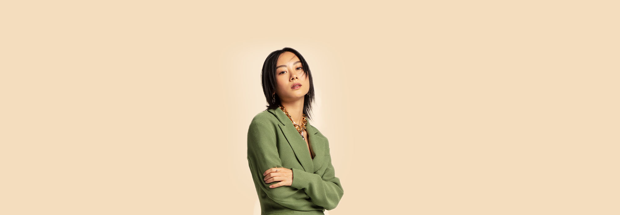 A woman in a green blazer