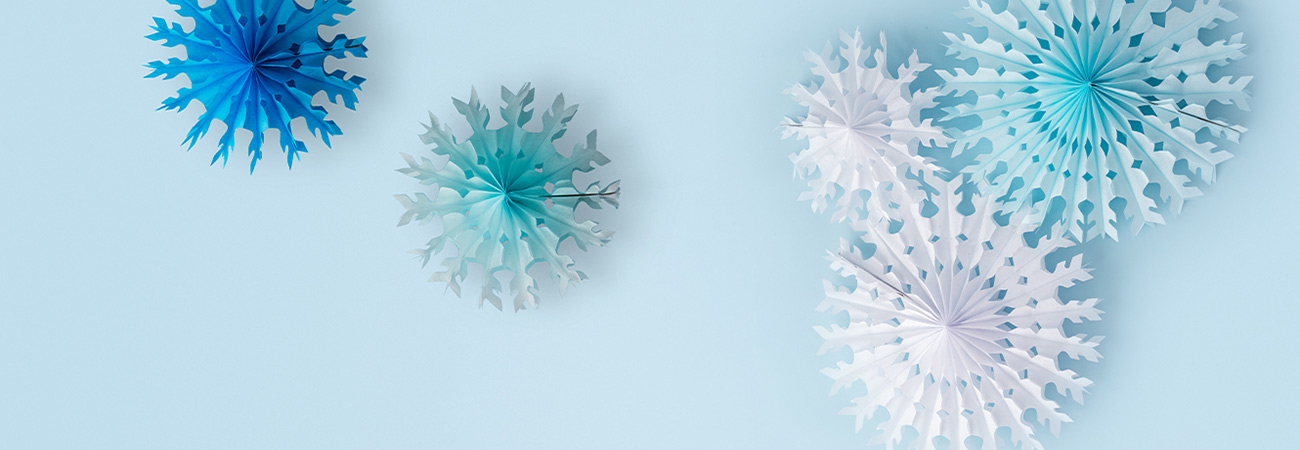 Paper snowflakes on a blue background