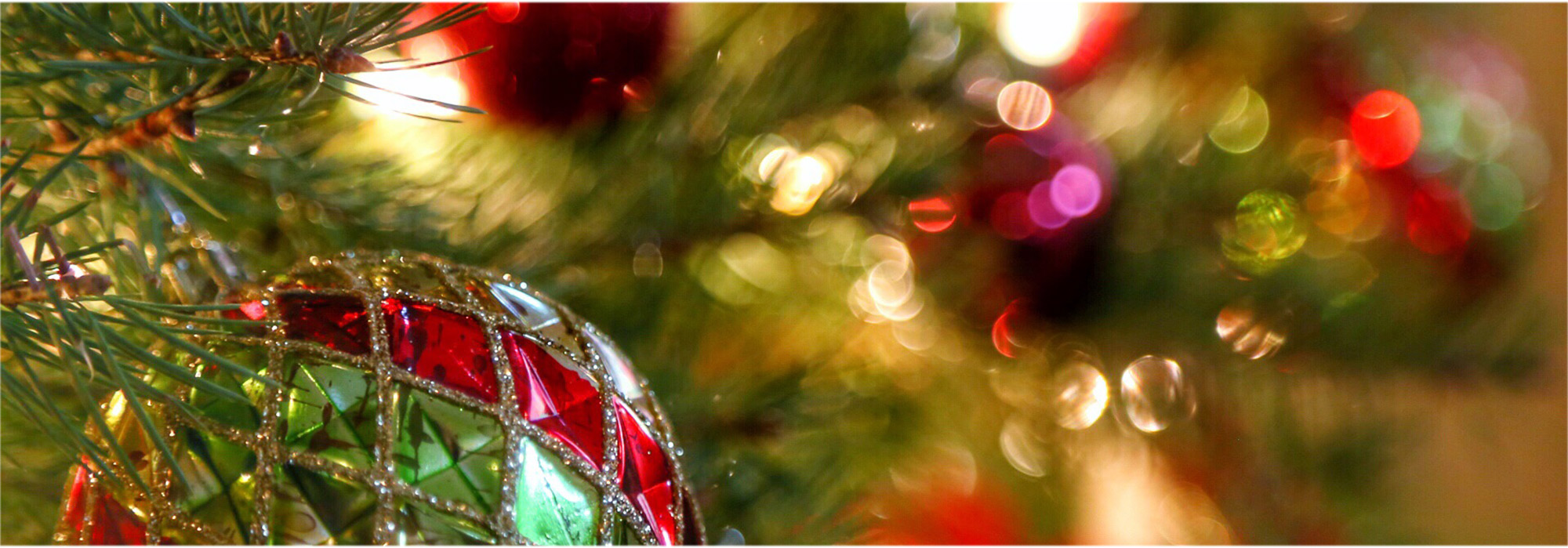 Shiny holiday ornaments on a tree