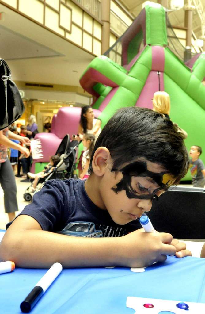 Child at Kids Club drawing.