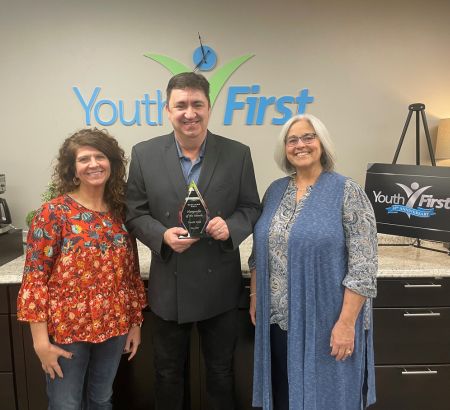Nonprofit of the Month award presentation at Youth First Offices