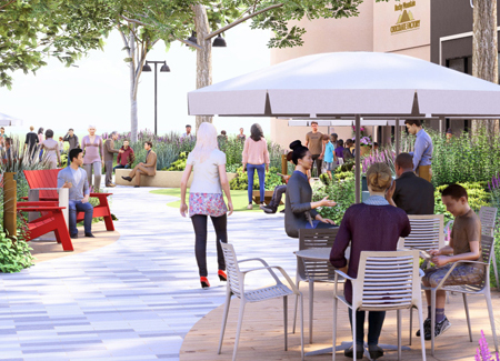 A family at covered bistro table with people walking around 