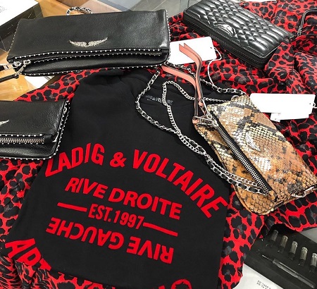 Zadig and Voltaire red and black shirt surrounded by purses