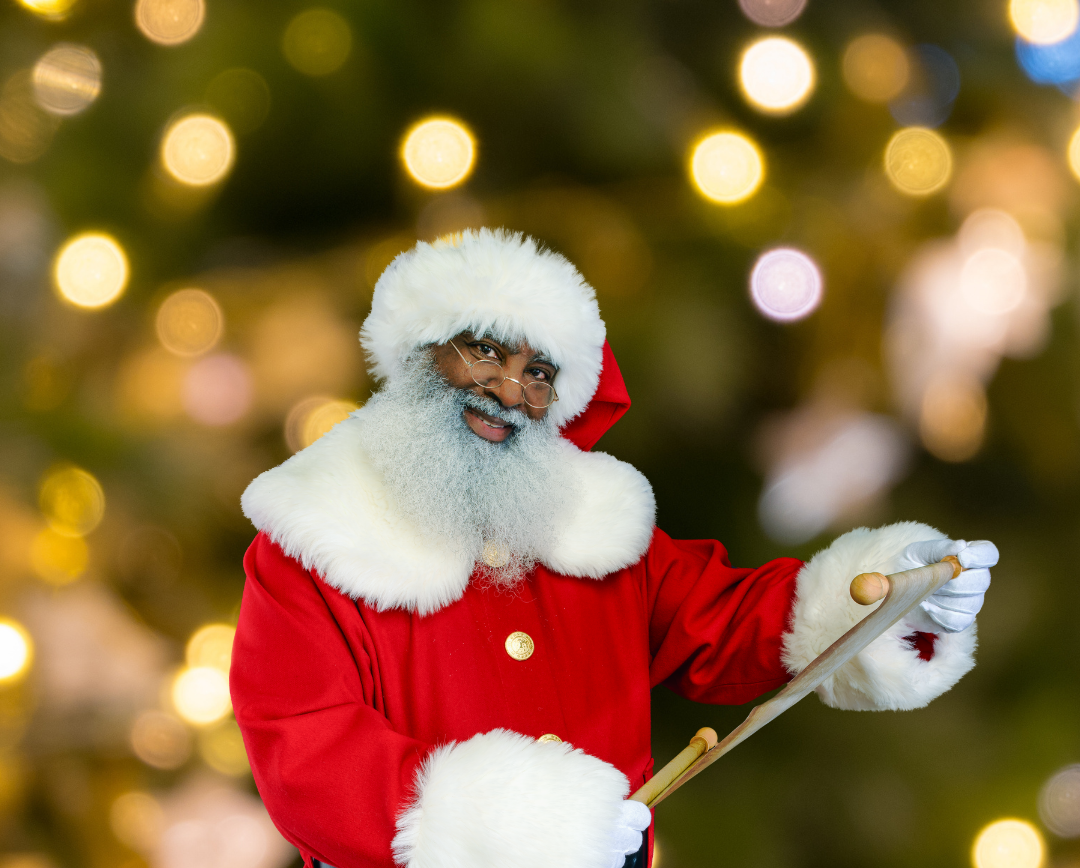 Black Santa holding a list