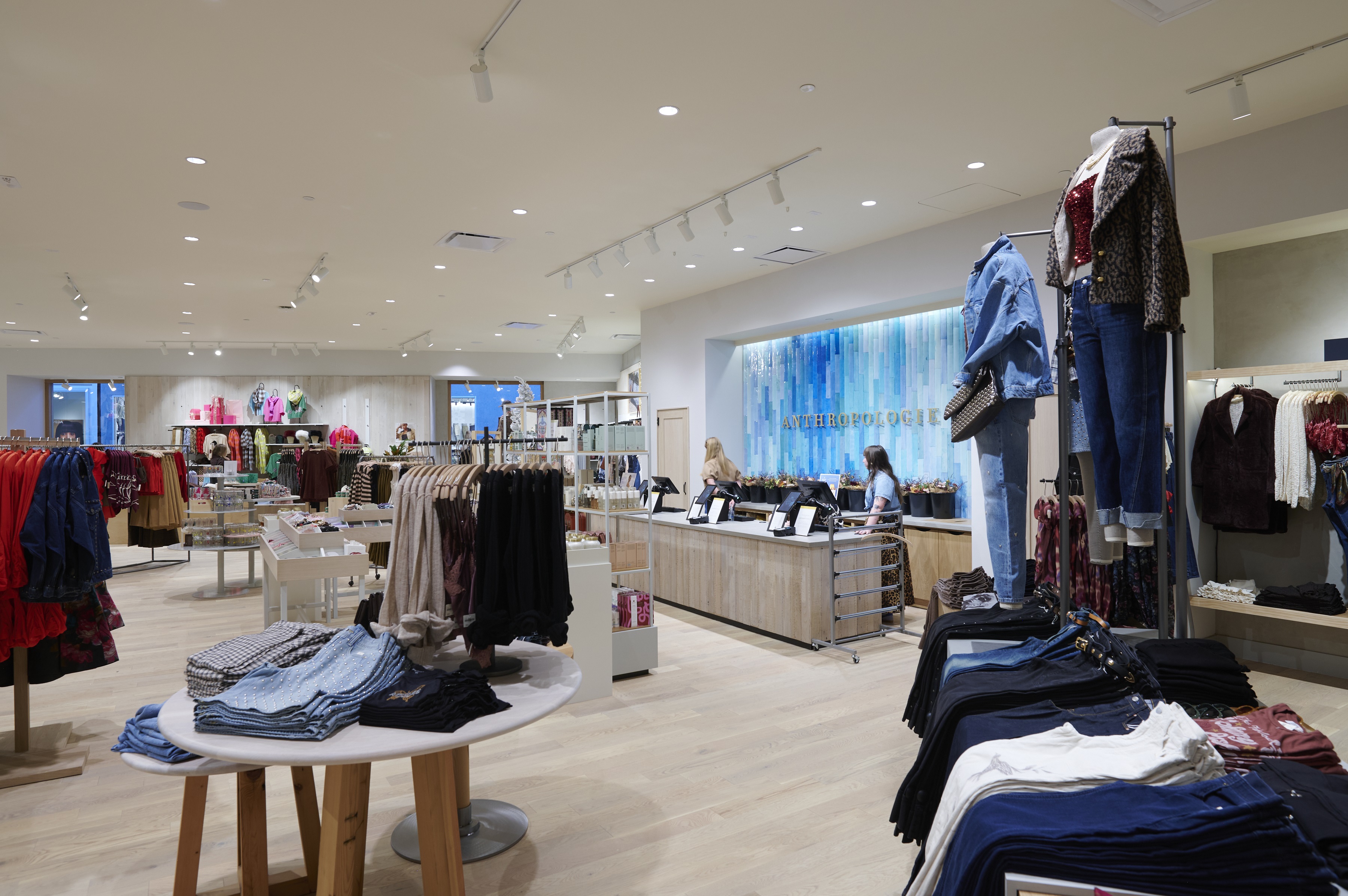 Colorful store barricade with text reading "Anthropologie opening fall 2025"