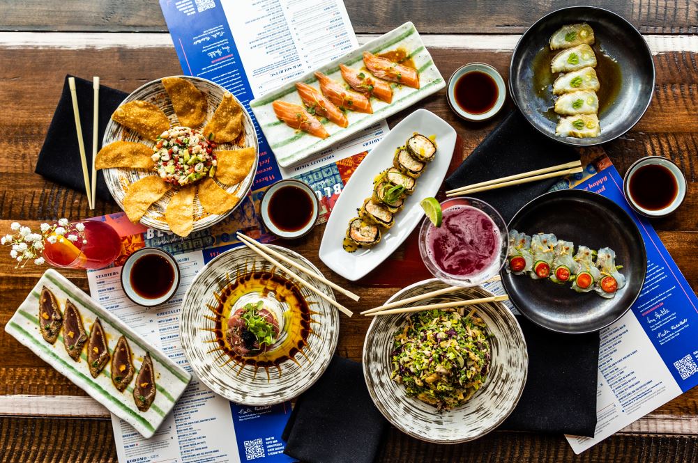 Overhead view of an assortment of sushi and drinks