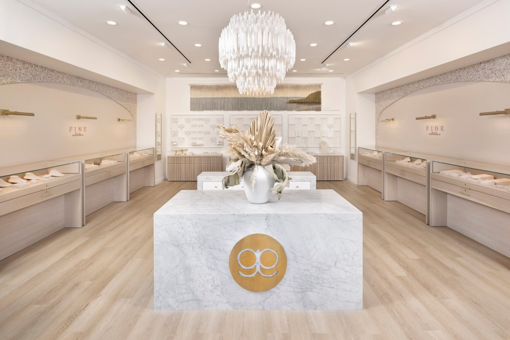 Interior rendering of a jewelry store with chandelier and granite counter