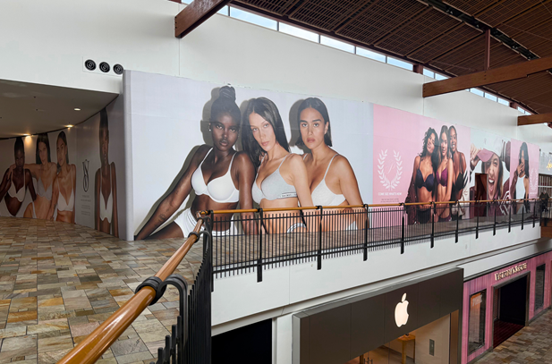 Store barricade with Victoria's Secret models in undergarments