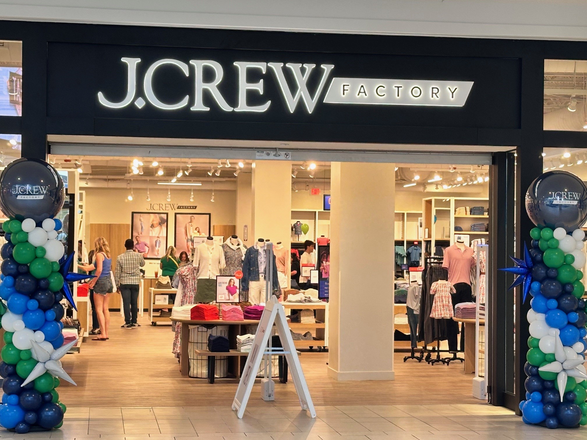 J.Crew storefront with people shopping inside