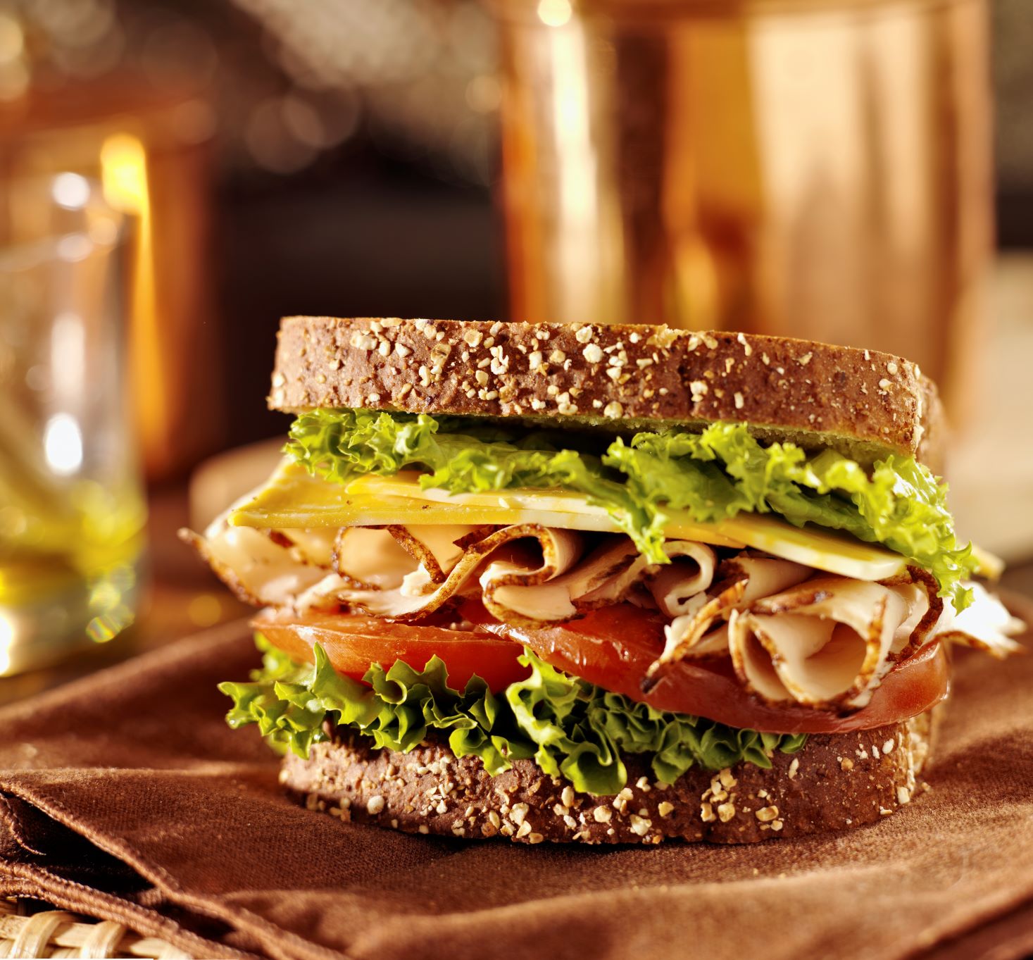 Turkey , cheese lettuce and tomato sandwich