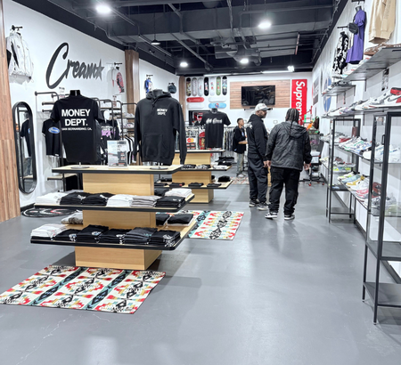 Shoppers browsing clothing at Cream