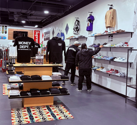 Shoppers browsing clothing at Cream