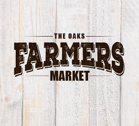 Farmers Market logo on wood plank background