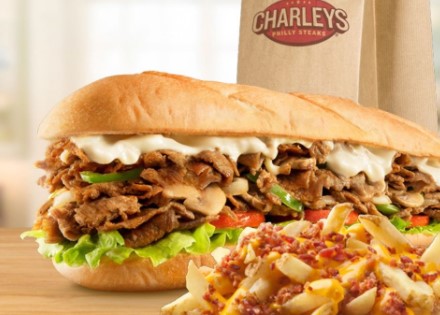 Charlies cheesesteak sandwich, fries and a charleys bag