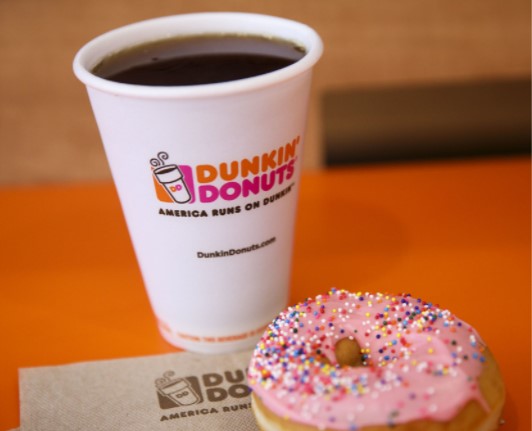 cup of coffee with dunkin donuts logo, donut with strawberry frosting and sprinkles