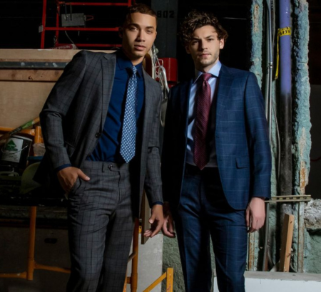 Two men posing in suits.