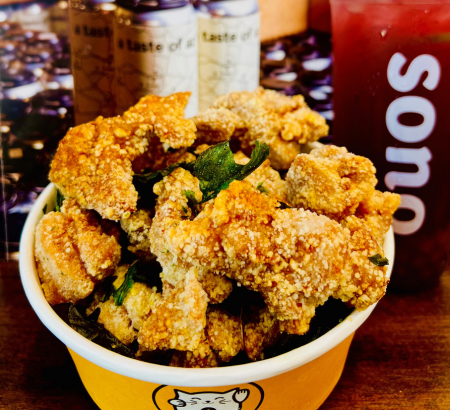 Bowl of breaded chicken next to Sono branded drinks.