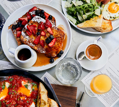 french toast and eggs for brunch with coffee and mimosa