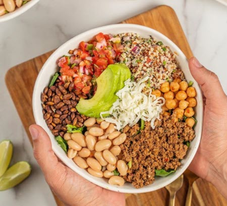 taco salad with avocado, beans and tomatoes