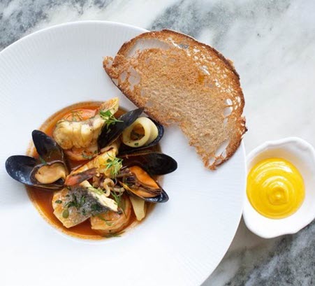 stew with shrimp and mussels. toasted bread on the side.
