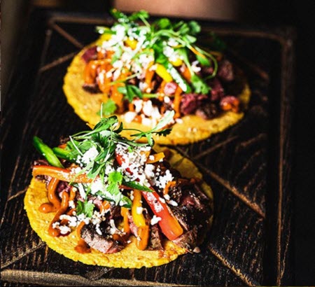 two tacos with chipotle sauce