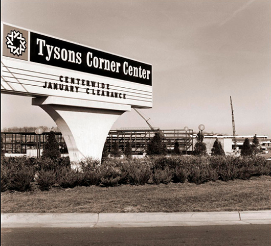 A vintage black and white photo of the Tysons Corner Center sign with copy readying "Centerwide January Clearance"