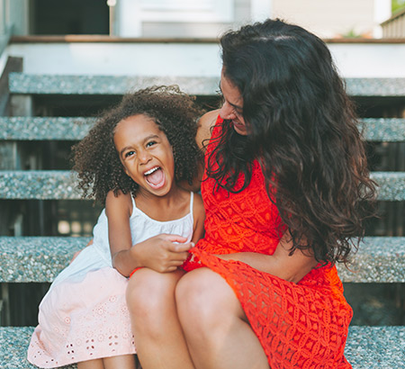 woman sitting with a little girl