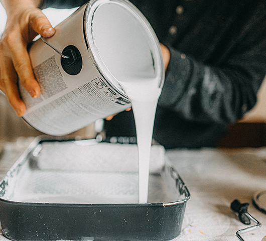 Paint being poured from a can