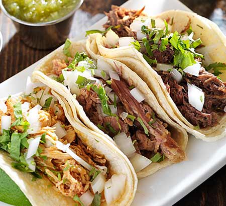 Three tacos on plate