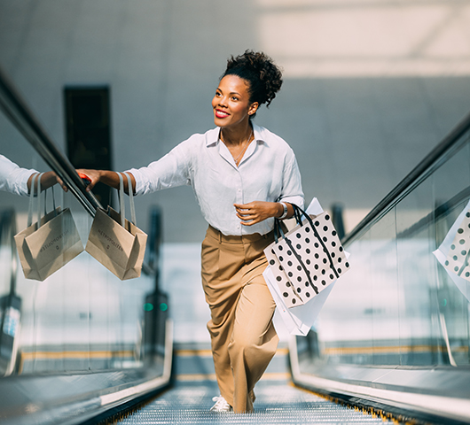 A shopper on an escalator