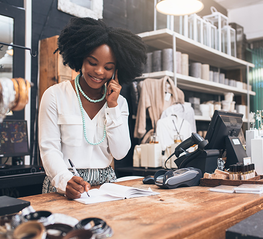 A woman working at a cash register in a store