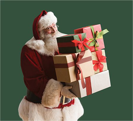 Santa holding a stack of presents