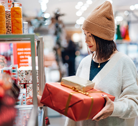 A woman shopping for presents at a store