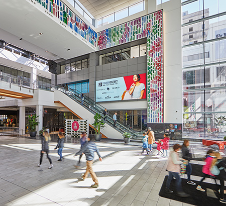 The foyer area and escalator at Fashion District Philadelphia